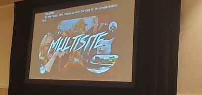 A presentation slide on a video screen.